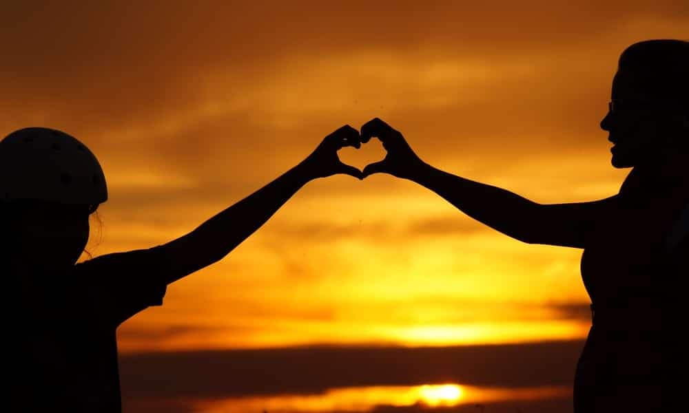 hands heart sunset